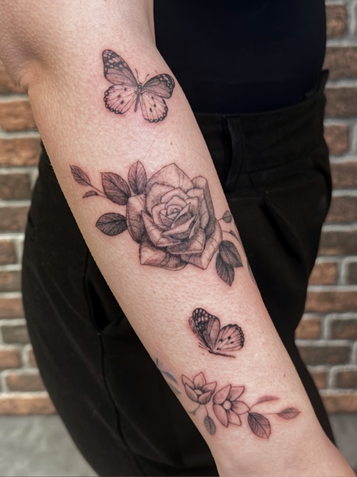 Elegant rose and butterflies fine line tattoo
